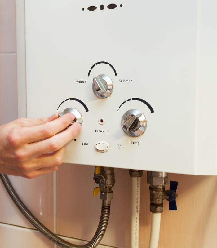 man hand close up adjusting water heater temperature peyton co man hand close up adjusting water heater temperature peyton co